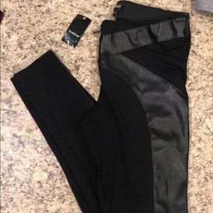 Black Bebe leggings with faux leather design